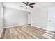 Spacious bedroom features a ceiling fan, new flooring, and bright natural light at 3448 Montreal Way, Tucker, GA 30084