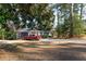 Charming single-story home with a vibrant red truck and well-maintained lawn, offering a cozy appeal at 3448 Montreal Way, Tucker, GA 30084