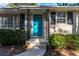 Close-up of home entrance showing a turquoise front door, framed by black decorative ironwork at 3448 Montreal Way, Tucker, GA 30084