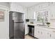 Modern kitchen featuring stainless steel appliances, white cabinets, and bright countertops at 3448 Montreal Way, Tucker, GA 30084