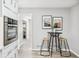 Stylish kitchen with oven and stainless steel appliances, complemented by a cozy breakfast nook with stools at 3448 Montreal Way, Tucker, GA 30084