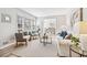 Spacious living room with plenty of natural light, modern decor, and wood flooring at 3448 Montreal Way, Tucker, GA 30084