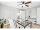 Well-lit home office featuring a glass top desk, modern decor, and a ceiling fan for comfort at 3448 Montreal Way, Tucker, GA 30084