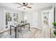 Bright home office with glass top desk, ceiling fan, and French doors leading to the exterior at 3448 Montreal Way, Tucker, GA 30084