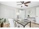Bright office space features a ceiling fan, glass desk, and modern decor at 3448 Montreal Way, Tucker, GA 30084