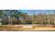 Montreal Park's entrance sign surrounded by mature trees, offering community green space at 3448 Montreal Way, Tucker, GA 30084
