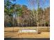 Montreal Park's entrance sign surrounded by mature trees, offering community green space at 3448 Montreal Way, Tucker, GA 30084