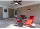 Enjoy the shaded patio with a ceiling fan, brick accents, and cozy seating area for outdoor relaxation at 3448 Montreal Way, Tucker, GA 30084