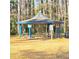 A picnic pavilion provides shaded seating at Montreal Park at 3448 Montreal Way, Tucker, GA 30084