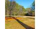 Swingset with playground, grass, and mature trees at Montreal Park in DeKalb County at 3448 Montreal Way, Tucker, GA 30084
