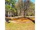 Swingset on a woodchip base surrounded by grass and trees in a neighborhood park at 3448 Montreal Way, Tucker, GA 30084