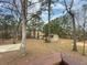 Wooded backyard with shed and lake view at 3657 Linda Dr, Loganville, GA 30052