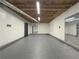 Finished basement with high ceilings and grey flooring at 3657 Linda Dr, Loganville, GA 30052