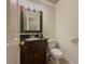 Updated bathroom with dark vanity and granite countertop at 3657 Linda Dr, Loganville, GA 30052