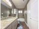 Updated bathroom with granite countertops and tile flooring at 3657 Linda Dr, Loganville, GA 30052