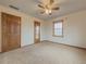 Spacious bedroom with ceiling fan and large closet at 3657 Linda Dr, Loganville, GA 30052