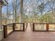 Deck with wooden railings offering scenic views at 3657 Linda Dr, Loganville, GA 30052