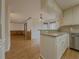 Open dining area with hardwood floors and view into kitchen at 3657 Linda Dr, Loganville, GA 30052