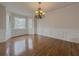 Bright dining room with hardwood floors, wainscoting, and bay window at 3657 Linda Dr, Loganville, GA 30052