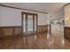 Spacious entryway with hardwood floors and wood paneling at 3657 Linda Dr, Loganville, GA 30052