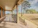 Spacious front porch with wooden floors and railing, overlooking yard at 3657 Linda Dr, Loganville, GA 30052