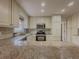 Bright kitchen with granite countertops and stainless steel appliances at 3657 Linda Dr, Loganville, GA 30052
