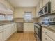 Well-equipped kitchen featuring granite counters and stainless steel appliances at 3657 Linda Dr, Loganville, GA 30052
