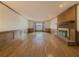 Living room features hardwood floors, brick fireplace, and bay window at 3657 Linda Dr, Loganville, GA 30052