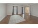 Hardwood floor living room with gray walls and french doors at 3657 Linda Dr, Loganville, GA 30052