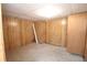 Unfinished basement room with wood paneling at 3035 Saint Andrews Dr, Duluth, GA 30096