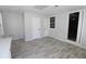 Bright basement area with wood-look floors and multiple doors at 3035 Saint Andrews Dr, Duluth, GA 30096