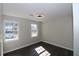 Bright bedroom with two windows and dark hardwood floors at 3035 Saint Andrews Dr, Duluth, GA 30096