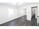 Bedroom with mirrored closet doors and hardwood floors at 3035 Saint Andrews Dr, Duluth, GA 30096