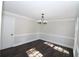 Formal dining room with hardwood floors and crown molding at 3035 Saint Andrews Dr, Duluth, GA 30096