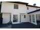 Home's exterior showcasing white siding and a deck at 3035 Saint Andrews Dr, Duluth, GA 30096