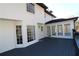 Home's exterior showcasing white siding and a deck at 3035 Saint Andrews Dr, Duluth, GA 30096