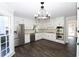 Renovated kitchen with white cabinets and stainless steel appliances at 3035 Saint Andrews Dr, Duluth, GA 30096