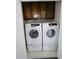 Laundry room with washer, dryer and cabinets at 3035 Saint Andrews Dr, Duluth, GA 30096