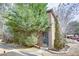 View of a home's side entrance featuring a lovely landscaped yard with mature trees and bushes at 3103 Colonial Way # A, Chamblee, GA 30341