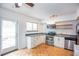 Kitchen featuring stainless steel appliances, granite countertops, and access to a patio at 3103 Colonial Way # A, Chamblee, GA 30341