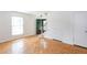 Bright living room featuring hardwood floors, a green front door, and a staircase at 3103 Colonial Way # A, Chamblee, GA 30341