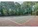 A tennis court surrounded by trees at 3103 Colonial Way # A, Chamblee, GA 30341