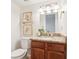 Cozy bathroom featuring a wood vanity with granite counters and a white toilet at 3420 Ashwood Ln # 3420, Atlanta, GA 30341