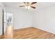 Bedroom featuring hardwood floors, ceiling fan, and a glimpse into the adjacent room at 3420 Ashwood Ln # 3420, Atlanta, GA 30341