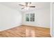 Bright bedroom with hardwood floors, a ceiling fan, and natural light from large windows at 3420 Ashwood Ln # 3420, Atlanta, GA 30341