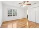 Bedroom featuring hardwood floors, ceiling fan, closet and natural light from the windows at 3420 Ashwood Ln # 3420, Atlanta, GA 30341