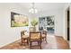 Cozy dining area with a glass table, wood chairs, and sliding glass doors to the patio at 3420 Ashwood Ln # 3420, Atlanta, GA 30341