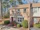 Charming brick townhome with a well-manicured lawn and a red front door at 3420 Ashwood Ln # 3420, Atlanta, GA 30341