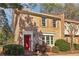 Charming two-story brick home with a vibrant red front door and manicured landscaping at 3420 Ashwood Ln # 3420, Atlanta, GA 30341