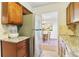 View of the kitchen leading into the dining room showing the stainless steel refrigerator at 3420 Ashwood Ln # 3420, Atlanta, GA 30341